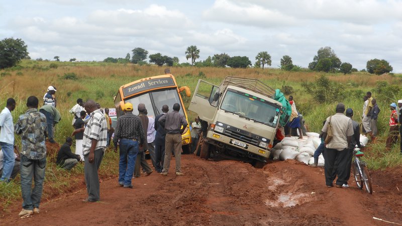 trucks stuck in mud in Uganda